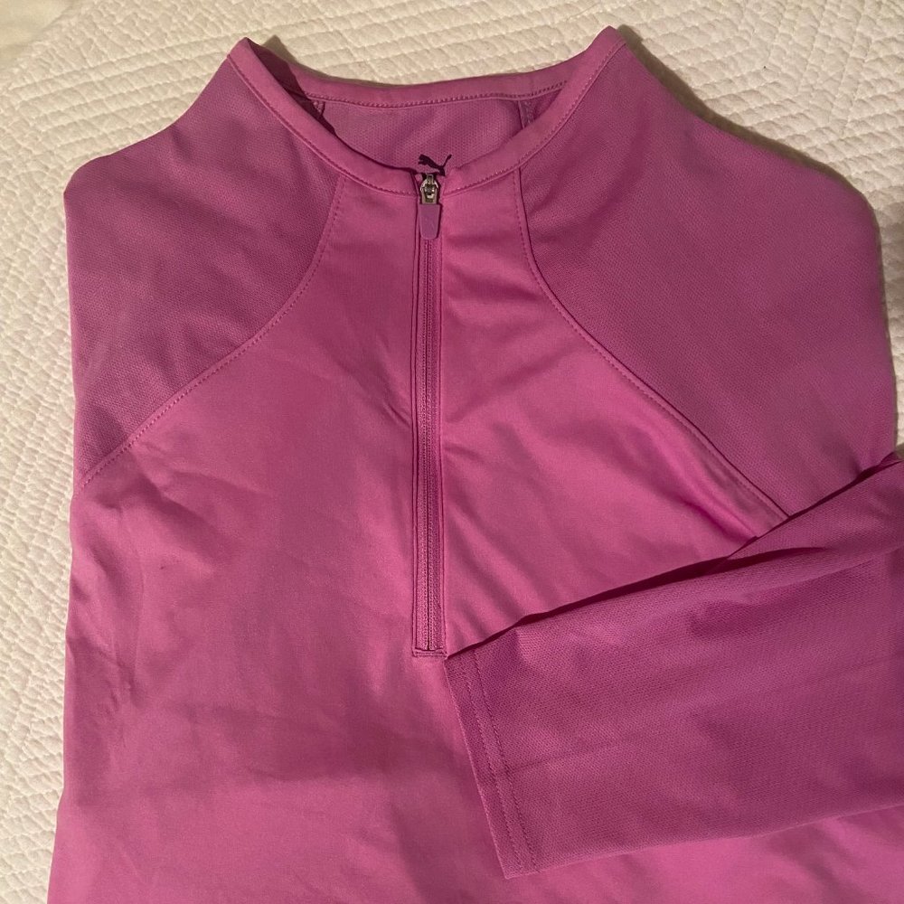 PUMA long sleeve athletic shirt with 1/4 zip front and shirt tail hem